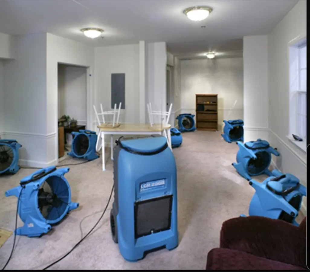 Air movers and dehumidifier setup for Water Damage Restoration in Amherst